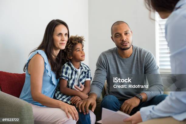 Couple Talking To Family Counselor Stock Photo - Download Image Now - Family, Meeting, Discussion