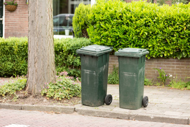 istock Image of wheelie-bins / dustbins in row, waiting for refuse collection 691524366