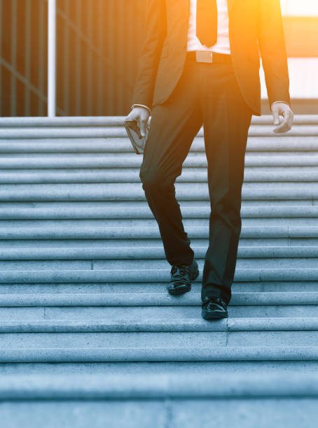 istock Success business man using tablet phone. Blue Toned Image. Concept businessman lifestyle. 691534388