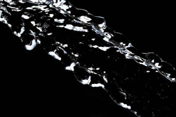 istock stream of water on a black background 691537618