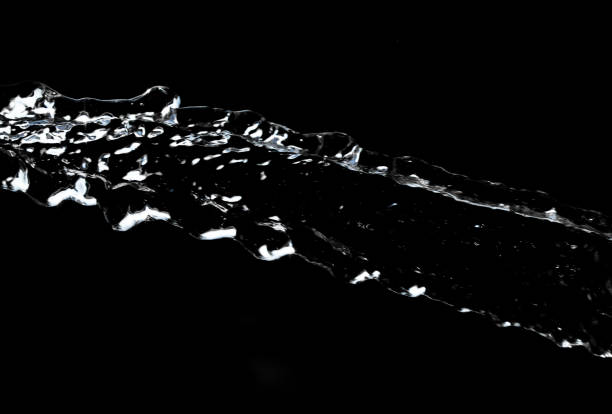istock stream of water on a black background 691537742