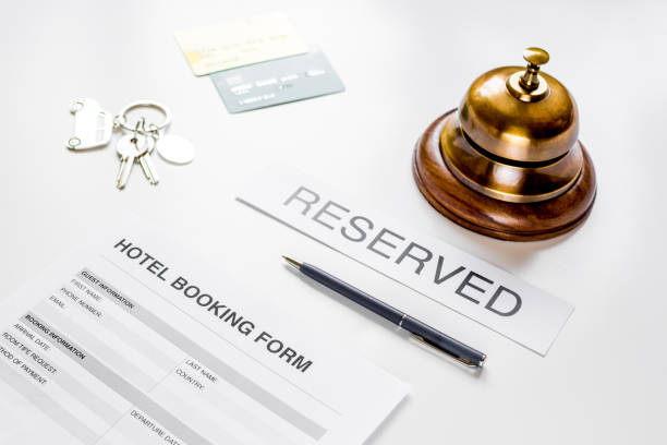 istock booking hotel room application form and keys white desk background 691538338