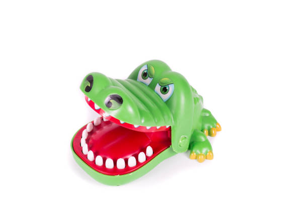 istock Crocodile doll isolated on white background 691544676