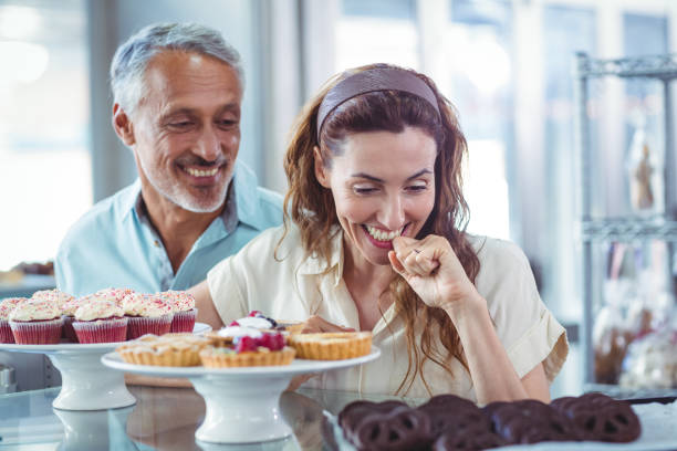 istock Cute couple looking at pastries 691547898