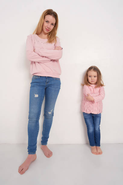 istock Mom and daughter posing in studio 691548444