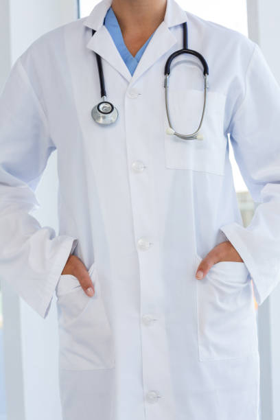 istock Female doctor standing with hands in pocket 691548492
