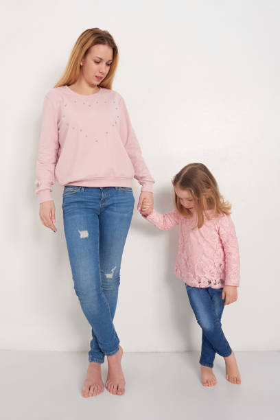 istock Mom and daughter posing in studio 691550696