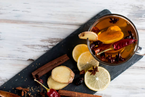 istock cup of tea with ginger, lemon and brown sugar 691551590