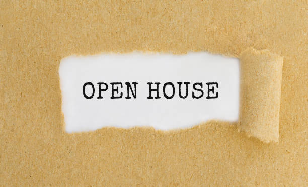 istock Text Open House appearing behind ripped brown paper. 691551596