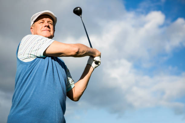 istock Golfer standing and swinging his club 691551996