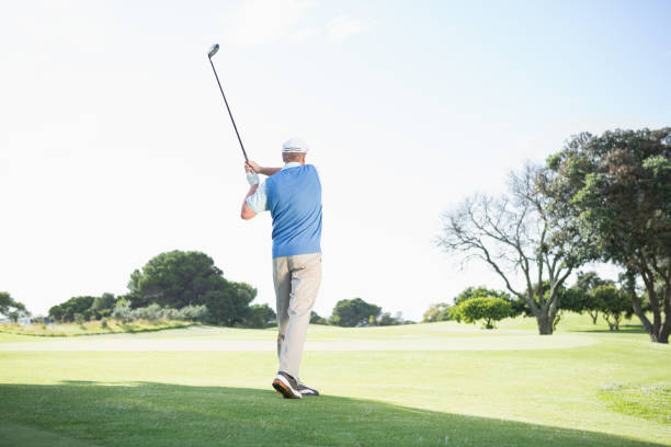 istock Concentrating golfer taking a shot 691552166