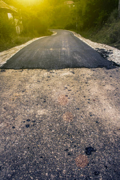 istock Incomplete mountain village road 691563614