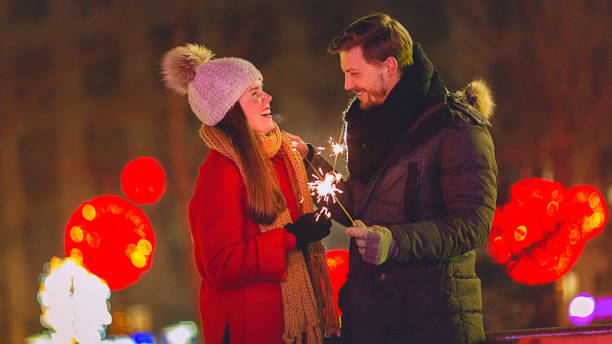 istock Young couple on a date at a public ice rink 691566460