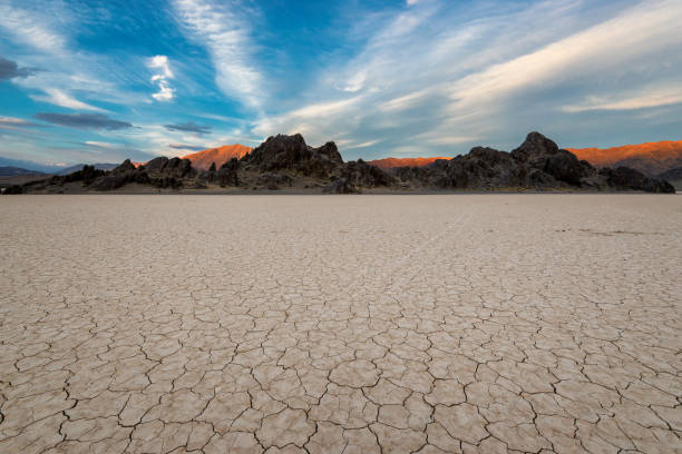 Racetrack Playa at sunset Landscape in Death Valley National Park, California lake bed stock pictures, royalty-free photos & images