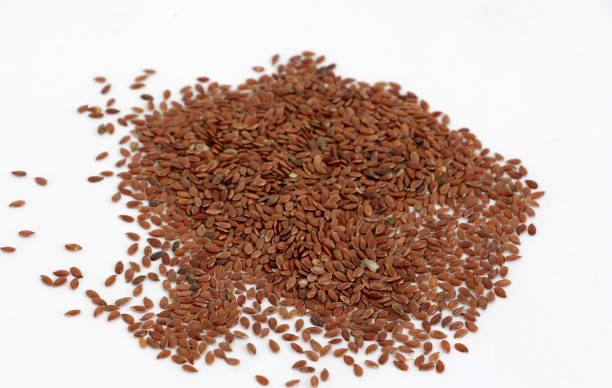 istock flax seeds isolated on white background 691570274