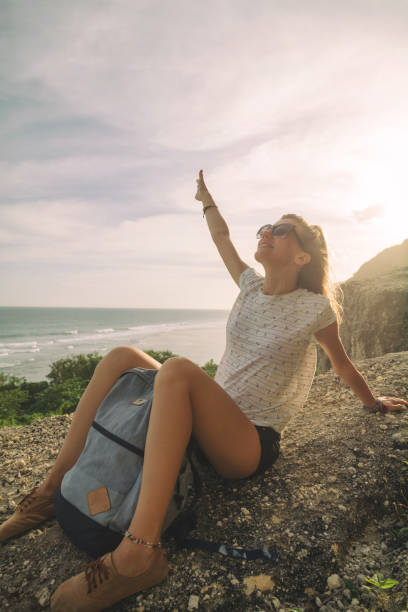 istock Tourist girl with backpack enjoying the view. 691570544