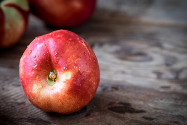 istock Healthy nectarines on the wooden background 691573366
