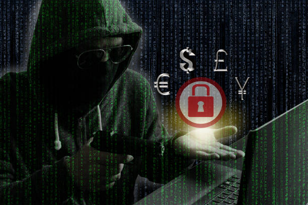 istock Ransomware concept : Hacker/Cyber criminal pointing gun into laptop computer as if demanding money from opposite site in exchange for unlocking computer. 691573594