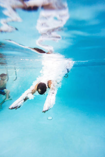 istock Kids having a good time in the pool 691573616