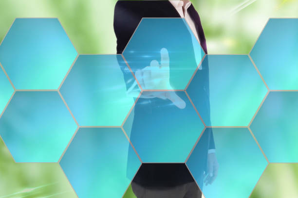 istock businessman in dark gray suit making decision in business by pushing on one hexagonal button. Businessman hand pushing digital screen 691576588
