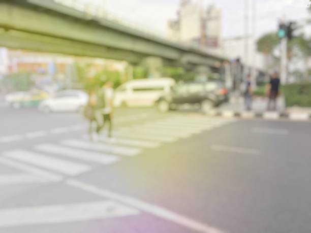 istock blurred  people crowd on zebra crossing the pedestrian crosswalk 691576850