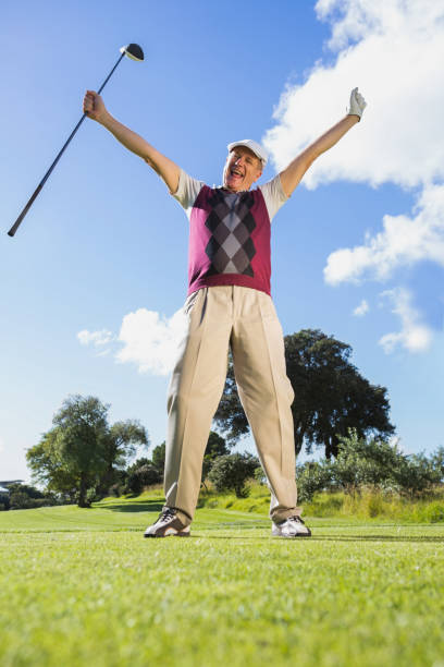 istock Excited golfer cheering and looking at camera 691580314