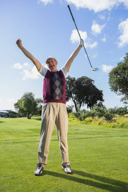 istock Excited golfer cheering and looking at camera 691580320