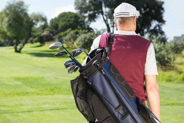 istock Golfer carrying his golf bag 691580338