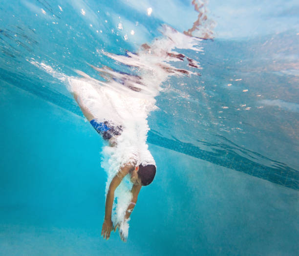 istock Kid having a good time in the pool 691582392