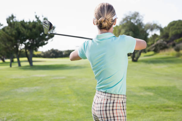 istock Female golfer taking a shot 691582674