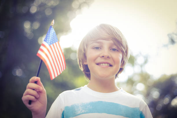 istock Little boy waving american flag 691585722