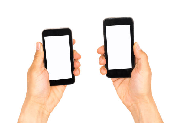 istock Two hands holding black smartphones 691586112