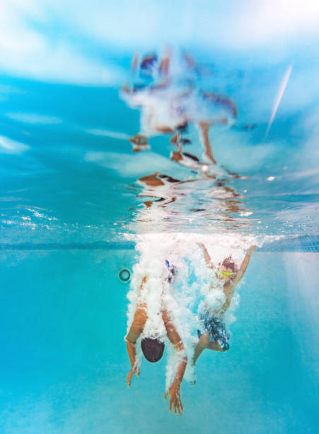 istock Kids having a good time in the pool 691586236