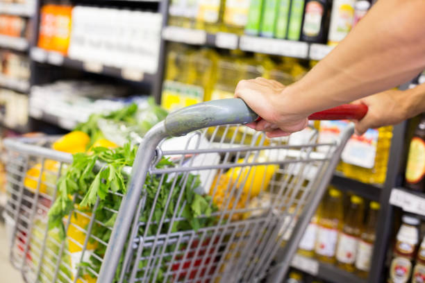 istock Man pushing his trolley on aisle 691596664