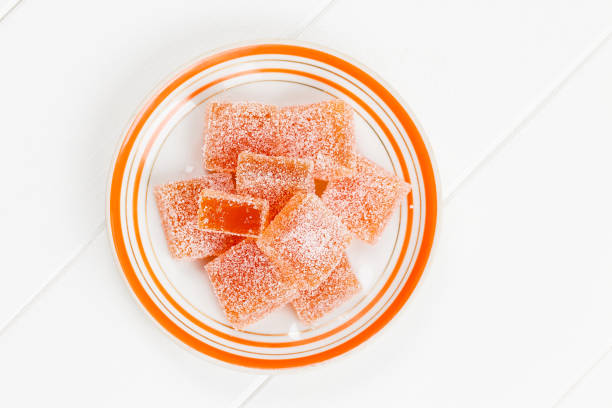 Homemade fruit jelly. Top view of orange marmalade on white background
