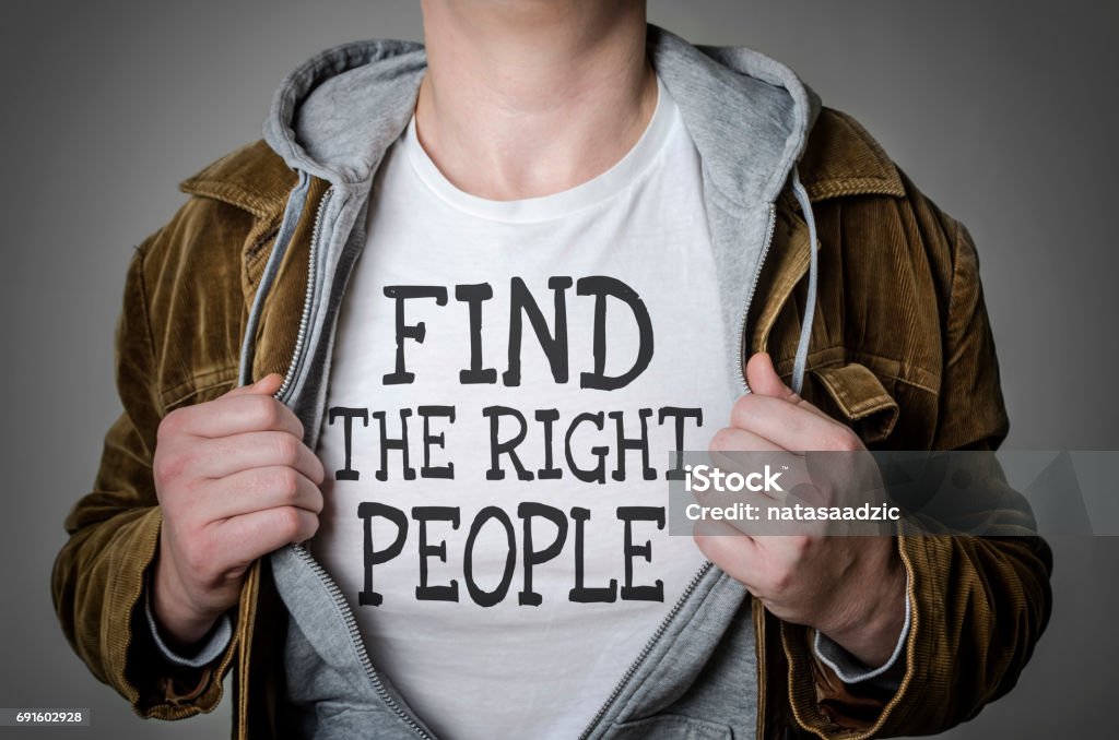 Find the right people Man showing Find the right people tittle on t-shirt. Human resources, partnership, choosing partner concept. Recruitment Stock Photo