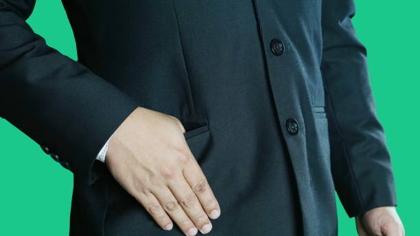 istock A man in black suit and his thumb in a pocket 691602932
