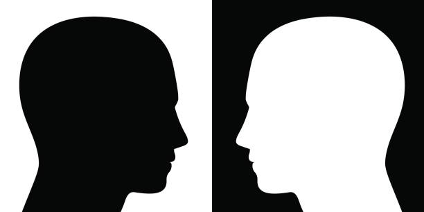 istock Opposing view - two heads facing each other, one is black on white, the other converse, as a symbol for adverse opinions, contrary ideas, opposite behavior or different beliefs or lifestyle. 691602974