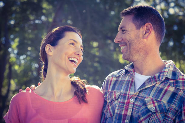 istock Happy couple smilling in park 691606874