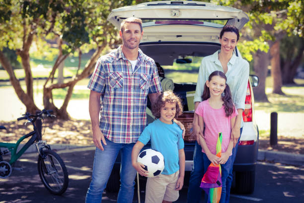 istock Happy family going for a camping in the park 691606908