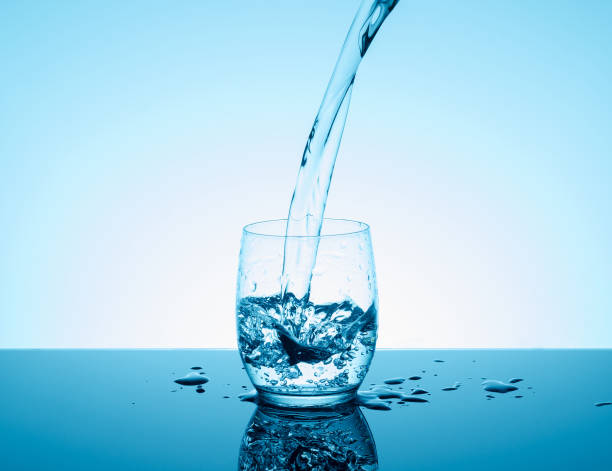 istock Creative splashing water in the glass 691609096