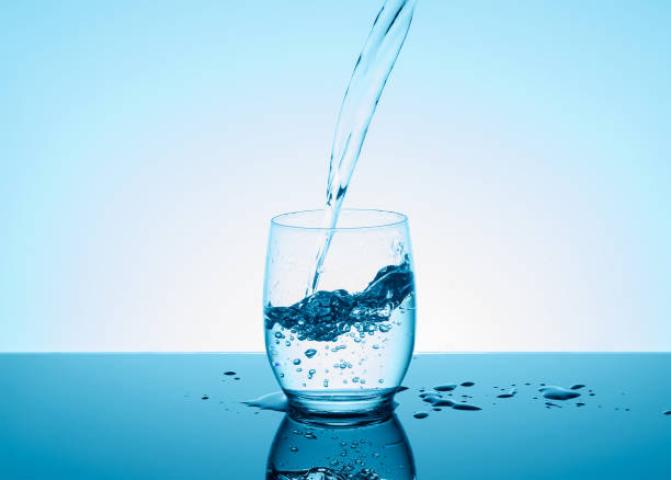 istock Creative splashing water in the glass 691609226