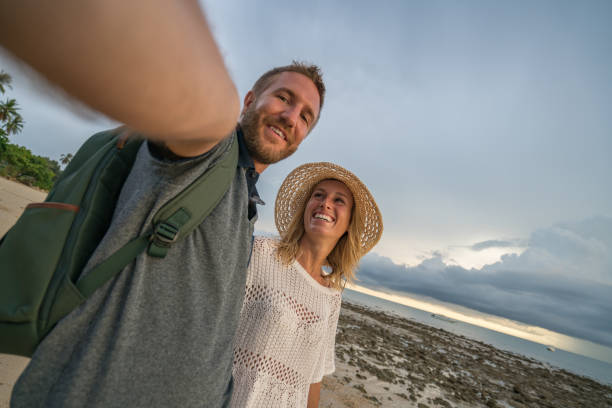 istock Couple taking selfie on beach 691609568