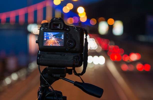 istock Professional dslr camera in city at night 691609750