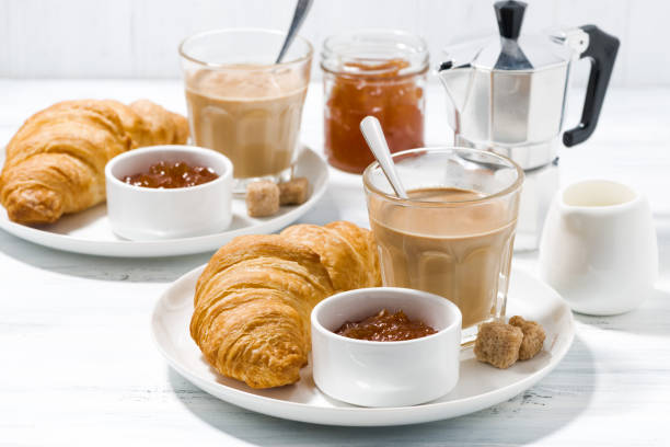 istock coffee with milk and croissants with jam for breakfast 691610406