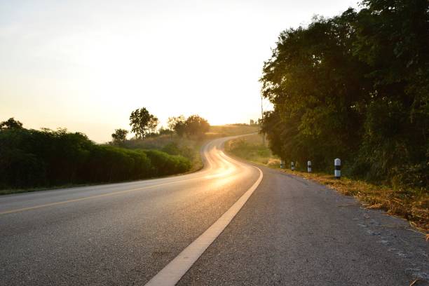 istock Hill and country road in morning 691610774