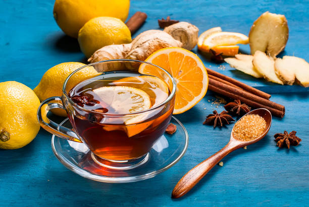 istock Cup of Ginger tea with lemon, honey on blue background 691613058