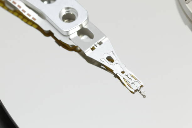 istock HDD. Magnetic head at the end of actuator arm 691613130