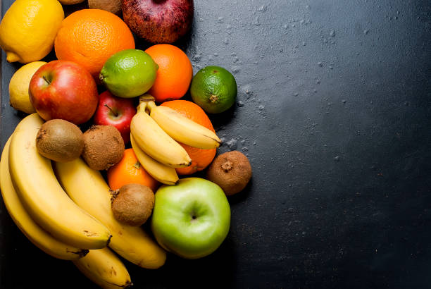 istock Many various fruits on a black background 691616176