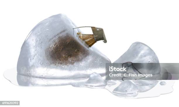 Time Bomb Represented By Unpinned Grenade In Melting Ice Isolated On White Background Stock Photo - Download Image Now